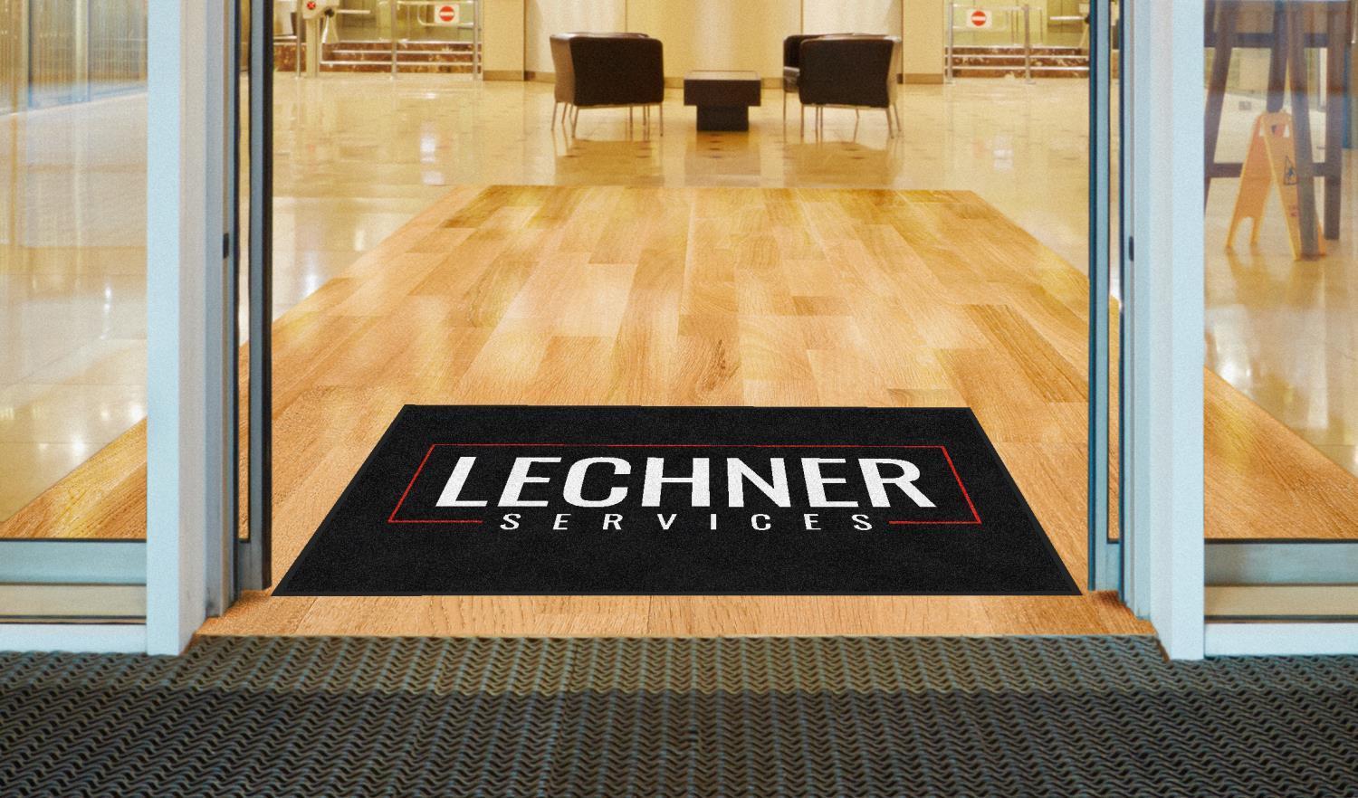 Lechner Services Logo Mat At An Entrance Door