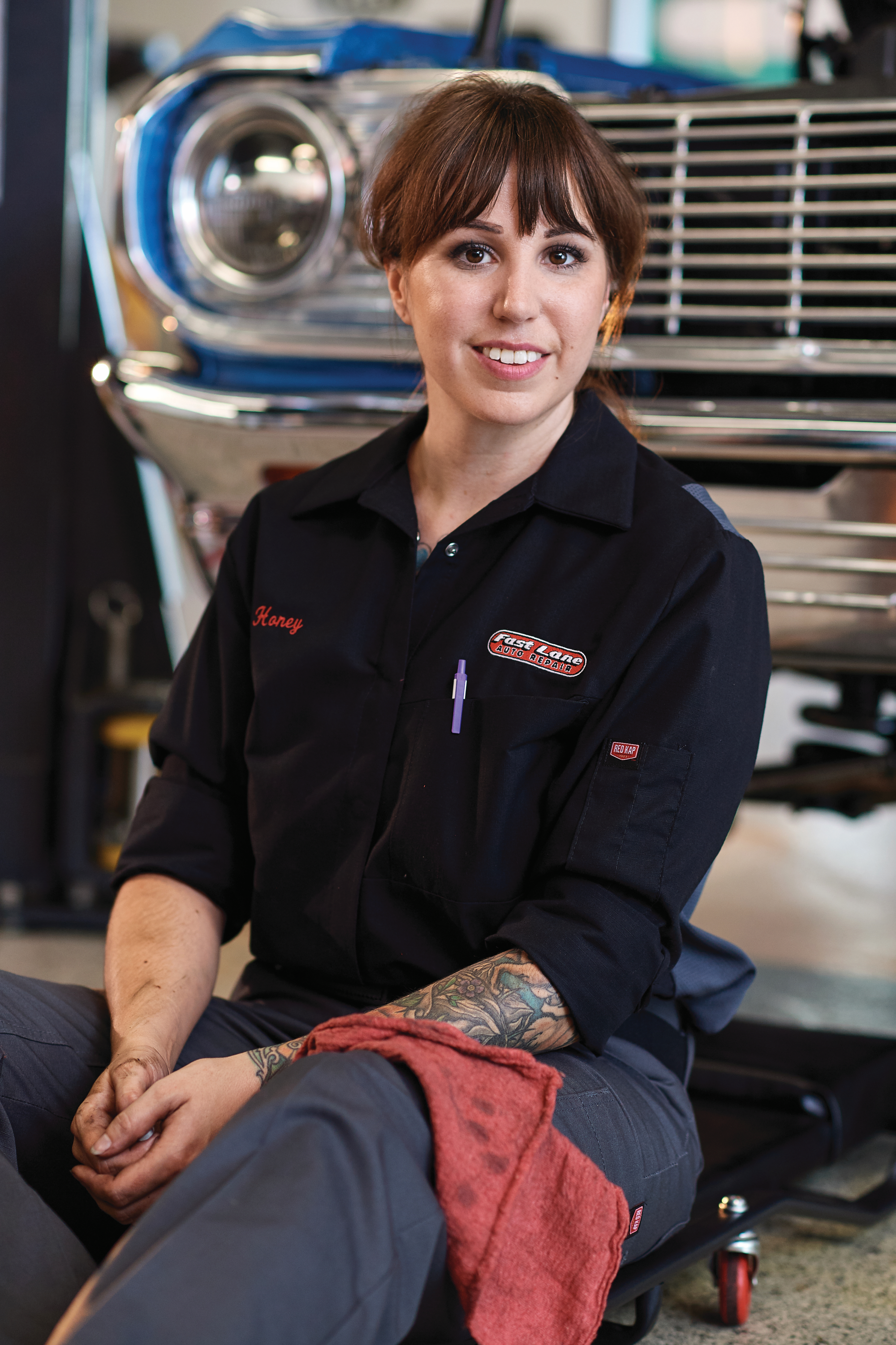 Uniformed mechanic with a red shop towel