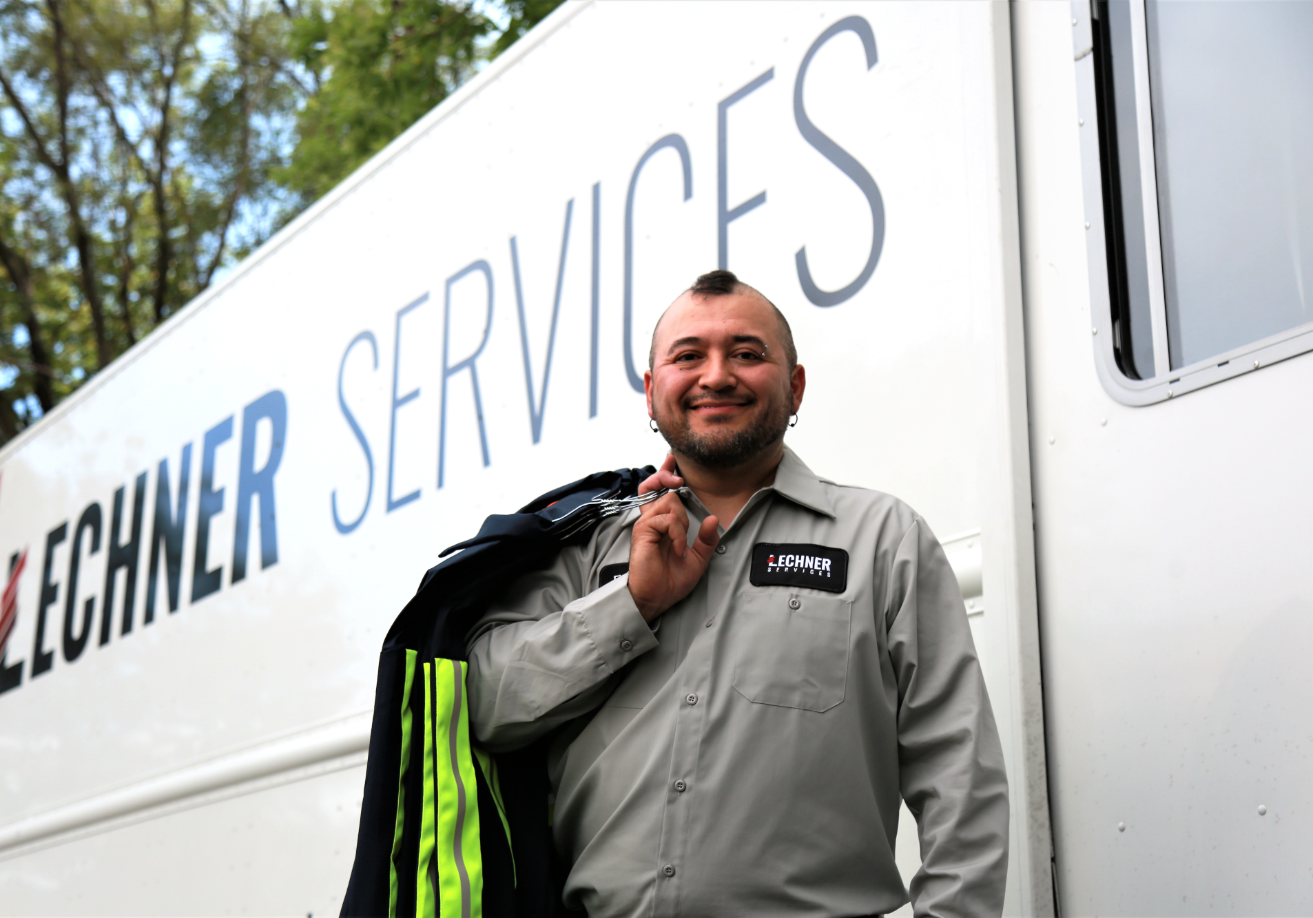A Lechner Route Service Representative delivering enhanced visibility uniforms